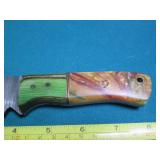 Hand crafted knife with a leather s...