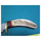 Hand crafted knife with a leather s...