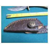 Hand crafted knife with a leather s...