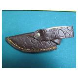 Hand crafted knife with a leather s...