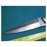 Hand crafted knife with a leather s...