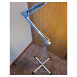 Adjustable White Floor Lamp with Articulating Arm and Weighted Base
