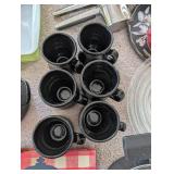 Kitchenware Collection with Pots, Roasting Pans, Mugs, and Cookbooks