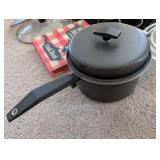 Kitchenware Collection with Pots, Roasting Pans, Mugs, and Cookbooks