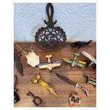 Eclectic Vintage Collectibles Lot with Toy Planes, Trivet, and Decorative Items
