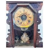 Antique Wooden Mantel Clock with Ornate Carving and Glass Door