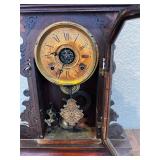 Antique Wooden Mantel Clock with Ornate Carving and Glass Door