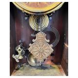 Antique Wooden Mantel Clock with Ornate Carving and Glass Door