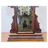 Antique Wooden Case Mantel Clock with Ornate Carving and Glass Panel