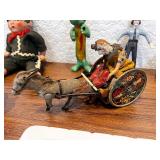 Collection of Vintage Toys and Collectibles Including Tin Wind-Up Donkey Cart, Gumby Figures, Model Trolley Cars