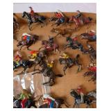 Collection of Vintage Plastic Cowboy and Native American Toy Figures on Horses