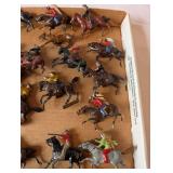 Collection of Vintage Plastic Cowboy and Native American Toy Figures on Horses