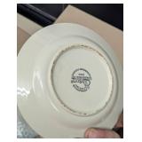 Two Boxes Filled With White Dishes