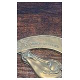 2 brass racing horse themed medallions