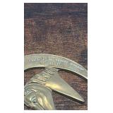 2 brass racing horse themed medallions