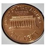 1963 Franklin Half Dollar, graded MS-69, plus four pennies from 1961 and 1963 with varying grades and defects.