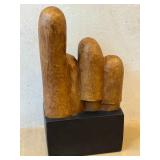 K - Replica Alva Museum Four Leaning Faces Sculpture