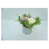 artificial flower arrangement in galvanized steel planter
