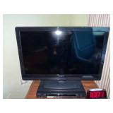 Insignia 32-Inch LCD TV with Sony DVD Player on Wood Stand