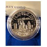 United States Liberty Coins 1986 - Ellis Island Silver Dollar & Statue of Liberty Half Dollar (Lot of 2)