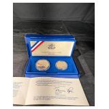 United States Liberty Coins 1986 - Ellis Island Silver Dollar & Statue of Liberty Half Dollar (Lot of 2)