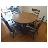 Round Wooden Pedestal Table With (2) Leaves and (4) Heavy Wood and Leather Chairs