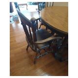 Round Wooden Pedestal Table With (2) Leaves and (4) Heavy Wood and Leather Chairs