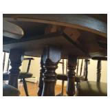 Round Wooden Pedestal Table With (2) Leaves and (4) Heavy Wood and Leather Chairs