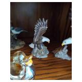 Middle Shelf of Bird Figurines, Bookends, Candy Dish and Suncatcher