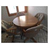 Table With (4) Upholstered Rolling Chairs and Leaf