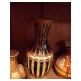 Bottom Shelf of Pottery