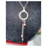 Sterling Silver Necklace with Garnet Accents and Circular Pendant