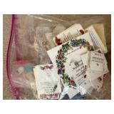 Collection of Gemstone Beads, Jewelry Findings, and Crafting Supplies in Bags and Box