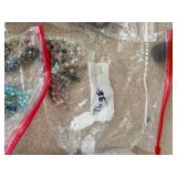 Large Collection of Assorted Beads and Strands in Plastic Storage Bin