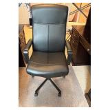 Black Adjustable Office Chair with Armrests and Rolling Base