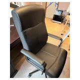 Black Adjustable Office Chair with Armrests and Rolling Base