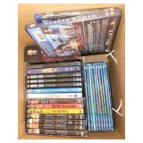 Collection of DVDs and Blu-rays including Finding Dory, Happy Feet, and Mystery Series