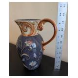 Vintage Embossed Floral Ceramic Pitcher with Scroll Handle