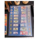 World Travel Collectibles Lot Including Iraqi Coins, Foreign Currency, Spoons, Figurines, and Wooden Display Rack