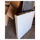 White folding table with black folding chair