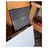 White folding table with black folding chair