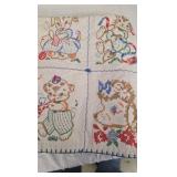 Vintage Baby Quilt with cross stitching animals.