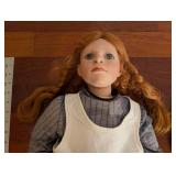 Doll With White Pinafore Dress And Two Straw Hats