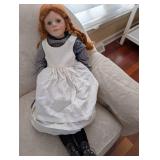 Doll With White Pinafore Dress And Two Straw Hats