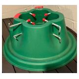Christmas Tree Stand, Green Plastic With Center Hole And Eight Red-Capped Bolts
