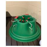 Christmas Tree Stand, Green Plastic With Center Hole And Eight Red-Capped Bolts