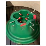 Christmas Tree Stand, Green Plastic With Center Hole And Eight Red-Capped Bolts