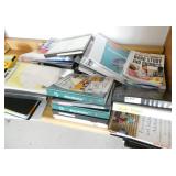 Rm 207 - Counter full of binders, bookshelf etc