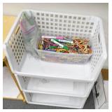 Rm 114B - 3 piles of books and a 3 shelf organizer with crayons