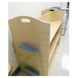 Rm 111B - 2 light stands and a double sided bookshelf and 3 balance discs